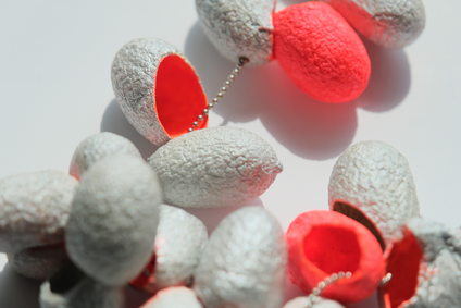 Long necklace made of 21 silk cocoons, bright orange inside, silver-coloured outside, on a thin stainless steel chain
