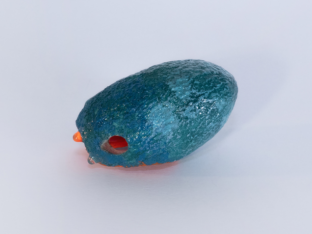 Pendant made of an open dark green silk cocoon, painted bright orange on the inside, on the outside are shiny drops