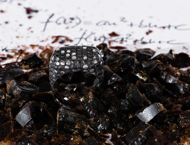 Black wide heavy silver ring with polished flat nubs surface, you can see some silver spots