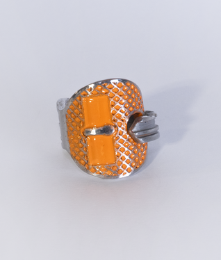 Aluminium key bent into a ring, two rectangular areas and the structured surface are filled with orange enamel