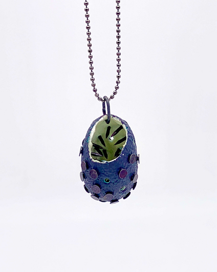 Pendant made of a dark blue, open silk cocoon, painted with noctilucent pigment inside, pierced with many nails through the cocoon, the tips point inwards