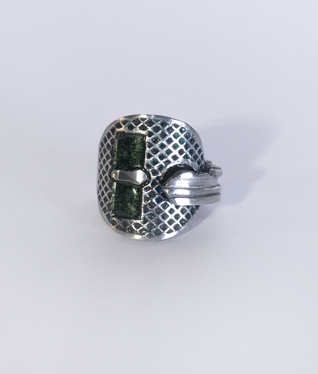 Aluminium key bent into a ring, two rectangular areas and the structured surface are filled with glitter green enamel